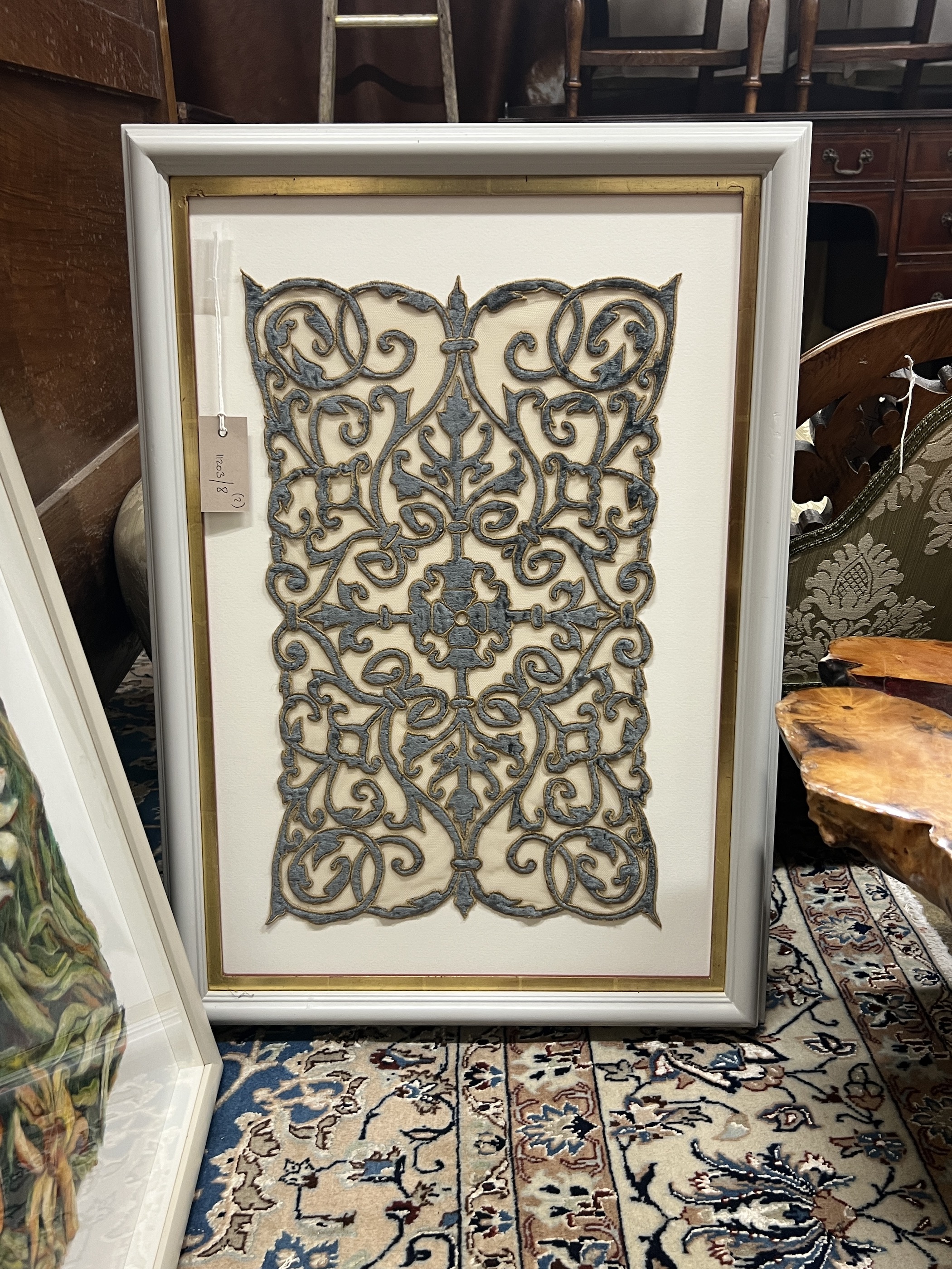 A framed velvet panel fragment and a framed floral woolwork panel, larger 38 x 59cm